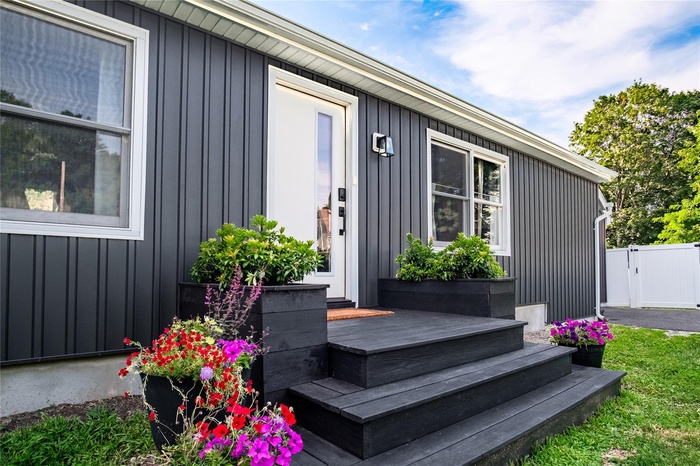 Property entrance with board and batten siding