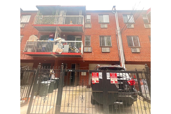 View of property featuring a fenced front yard