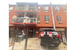 Legal 3 dwelling brick house located in the heart of Elmhurst, built in 1999.