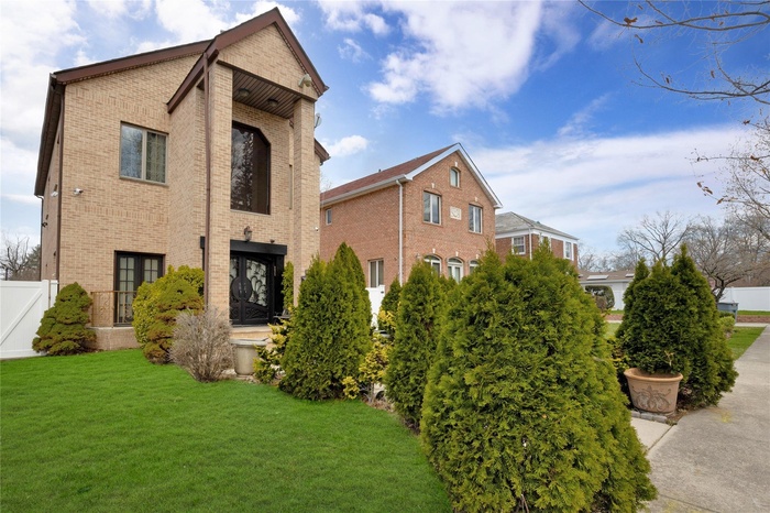 View of front facade featuring brick siding