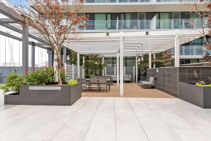 View of patio / terrace with a pergola, outdoor dining space, and a wooden deck