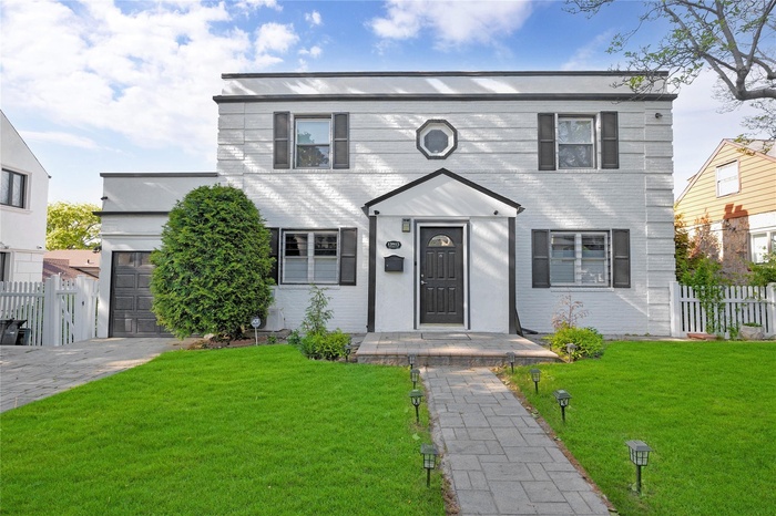 View of front of home with an attached garage