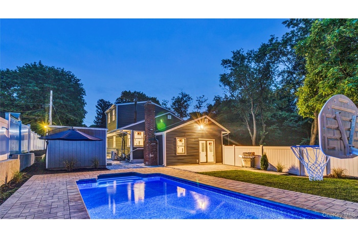View of swimming pool featuring an outbuilding