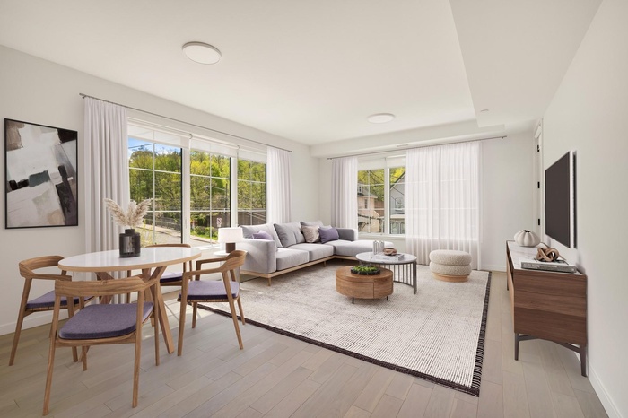 Living area with light wood-style floors and baseboards