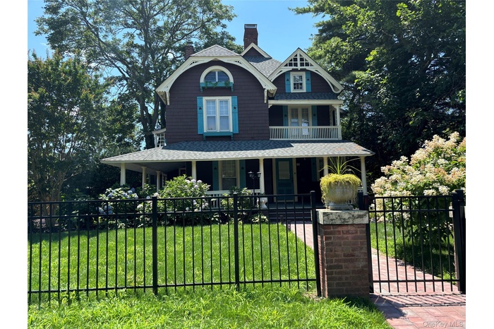 Beautifully renovated Tudor with fenced yard Flowering landscaped front yard