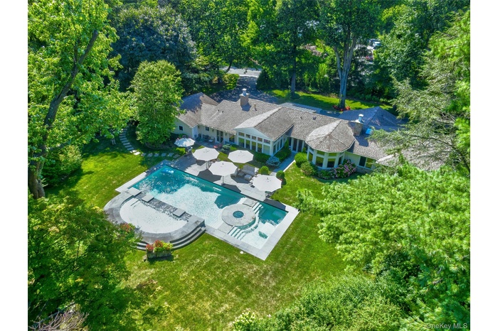 View of subject property with a pool area