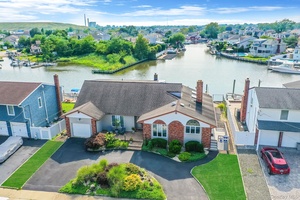 Live the dream on this rare 80 foot wide waterfront property !