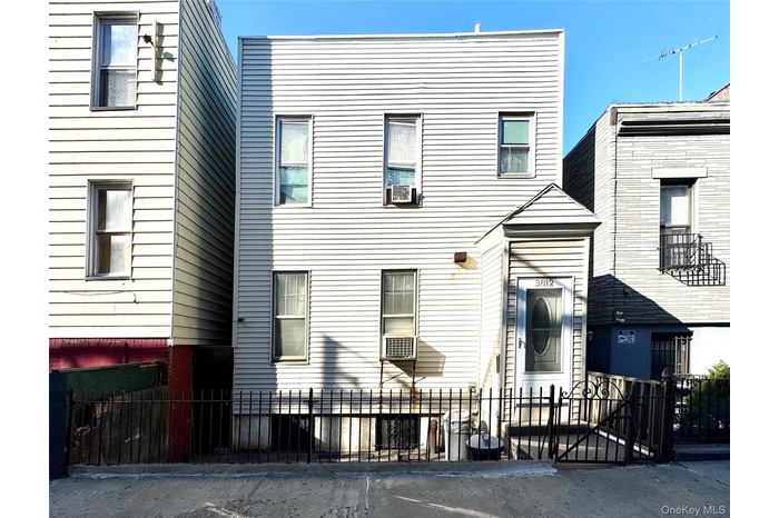 View of front of property with a fenced front yard