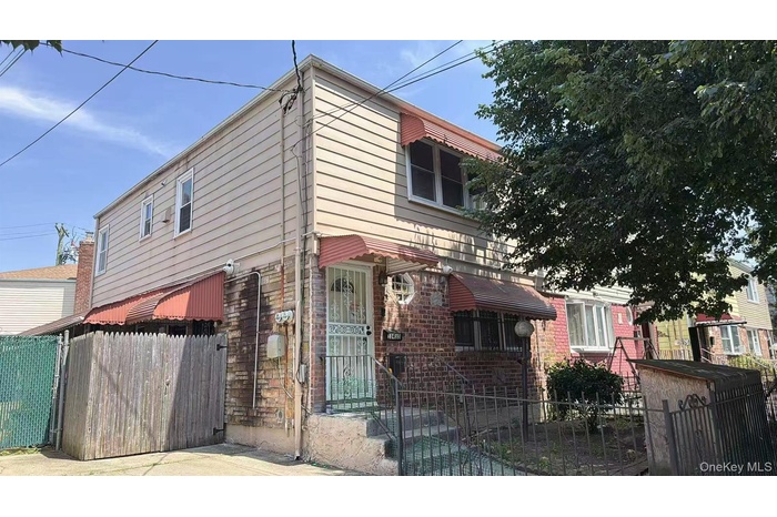 View of front of property with a fenced front yard