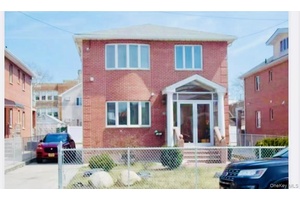 Beautiful Brick young large one family on a quiet tree lined street.