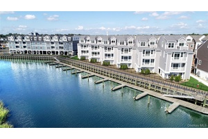 Welcome to 535 Marina Pointe Drive, a thoughtfully designed 2 bedroom, 2 bath condo suite offering 1, 241 square feet of stylish, open concept living.