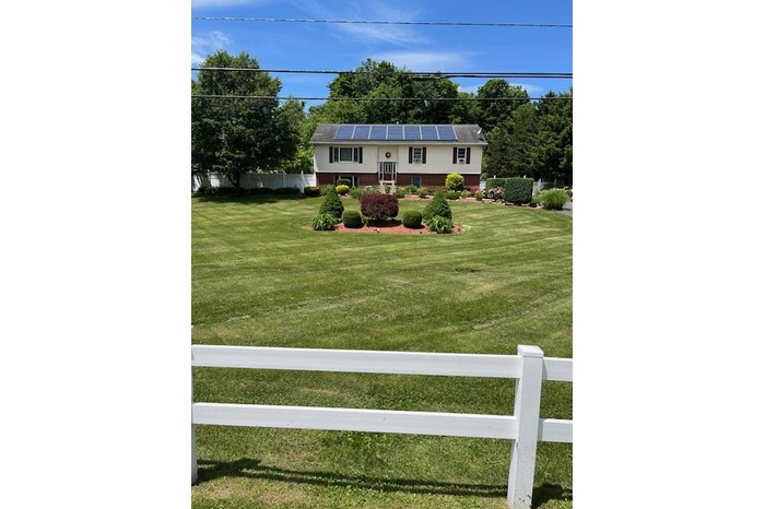 View of yard featuring fence