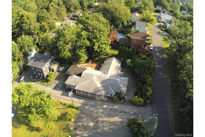 Aerial overview of property's location featuring nearby suburban area
