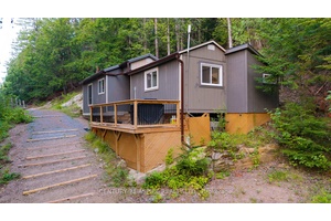 A Rare and Affordable Retreat on Pristine Trout Lake !