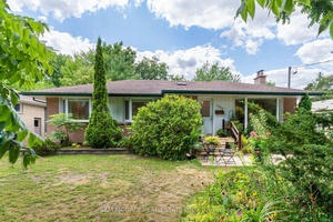 Welcome to 1300 Twin Oaks Dell, a beautifully maintained bungalow set on a generous 70 x 145 foot lot in prestigious Lorne Park.