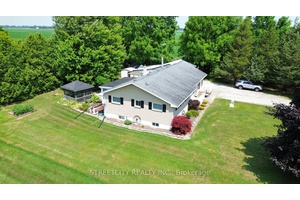 Tucked on a peaceful half acre surrounded by mature trees, this beautifully maintained, custom built raised ranch is ready for your next chapter.