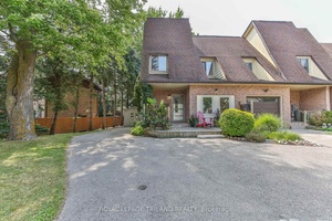 Welcome to 2030 Aldersbrookan end unit freehold townhome that radiates warmth, care, and pride of ownership.