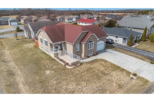 Welcome to 55 Rowan Drive a custom built, all brick executive residence set proudly on a prime corner lot in one of Morrisburg's most sought after neighborhoods.