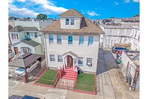 Oversized 2 Family Home with Massive Garage amp ; Private Parking Prime Location !
