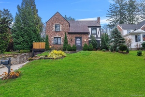 Exceptional Tudor in Strathmore This renovated home blends historic charm with contemporary elegance.