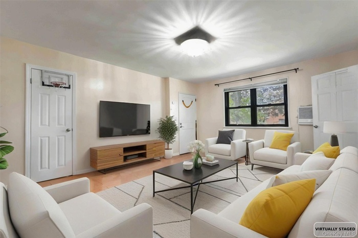 Living room with light tile patterned floors and baseboards