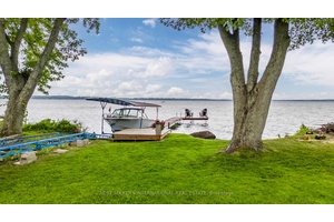 Rare 69 feet of pristine waterfront frontage on Lake Simcoe in Cooks Bay !