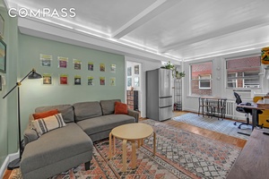 This one bedroom, one bathroom co op unit at The Manor boasts timeless elegance and modern functionality.