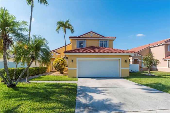 Move in ready lakefront pool home in Chapel Trail with resurfaced pool, screened patio, fire pit, pavers, and outdoor shower perfect for entertaining.