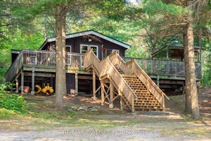 Escape to your own slice of paradise with this three bedroom, one bathroom Panabode cedar cottage that perfectly balances rustic charm with comfort.