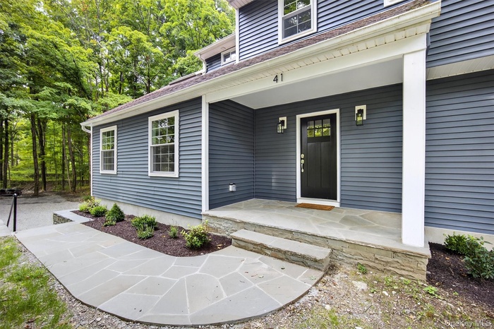 Entrance to property with a porch