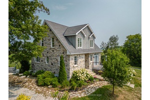 This one of a kind country estate, situated at the top of Scotch Mountain overlooking the town of Meaford, features a modern stone farmhouse originally designed by renowned architect Napier ...
