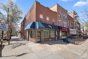 Woodside corner mixed use building for sale.