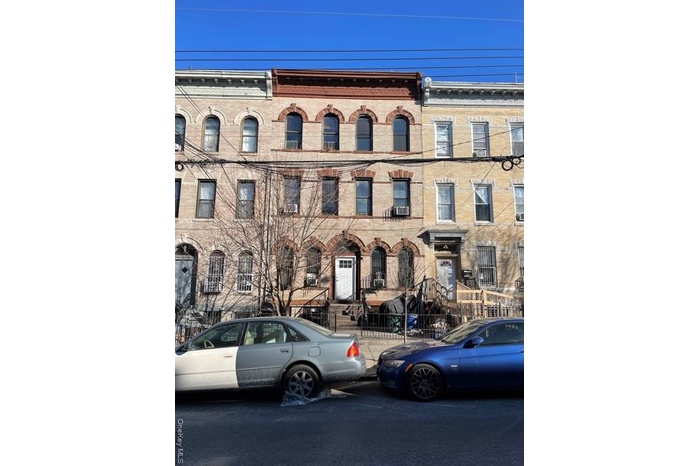 View of front of house featuring brick siding