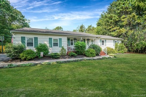 Set on a private 1. 1 acre horse property in Miller Place, this home blends space, privacy, and warm character.