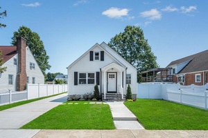 WOW ! Completely renovated inside and out, this stunning home features 3 spacious bedrooms, 3 beautiful baths, and a full finished basement with a convenient side entrance.