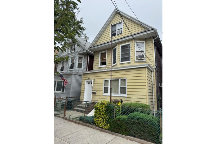 View of front of property with a fenced front yard