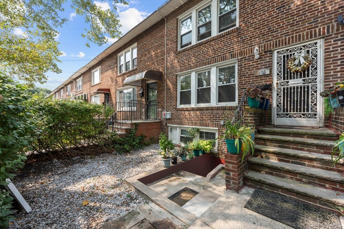Entrance to property with brick siding