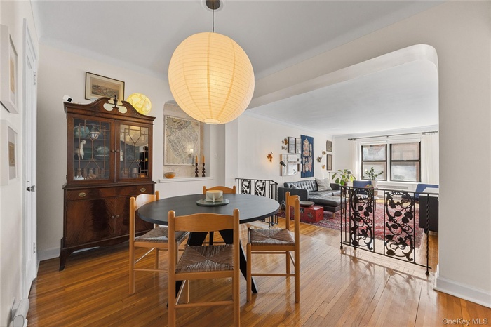 Dining area featuring hardwood / wood-style flooring and baseboards