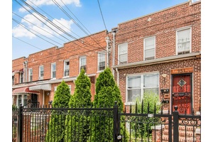 Presenting a recently renovated, legal two family attached brick home located on a quiet residential street in the highly desirable North East Bronx.