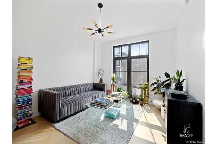 Living room featuring a chandelier