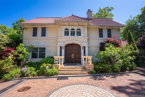 This elegant colonial home ideally situated in the sought after Village of Kensington.