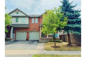 Welcome To Bronte Creek. This End Unit Has Lots Of Sunlight With An Oversized Backyard And A Spacious Deck.