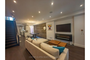 Welcome to this stunning end unit home feels like a semi detached, featuring 4 bedrooms and 5 bathrooms, thoughtfully designed to blend modern luxury with timeless Victorian charm.