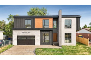 This newly built modern custom home offers over 5000 sq ft.