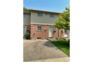 Beautifully updated 3 bedroom, 2 bathroom townhouse available for lease, featuring a fully finished basement and a private, fenced in patio backing onto shared green space.