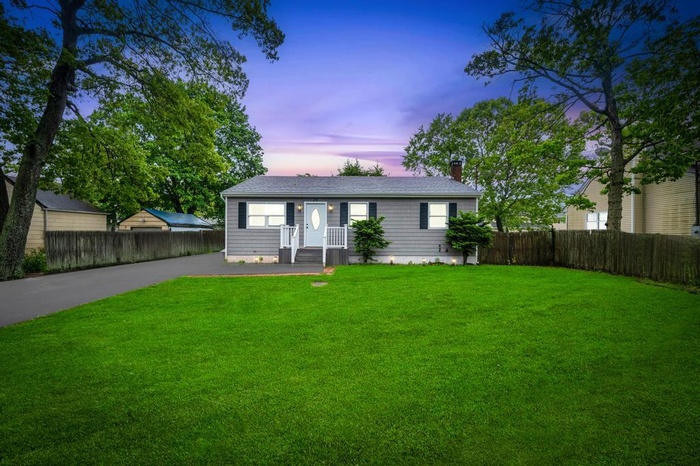 View of front of home featuring a chimney