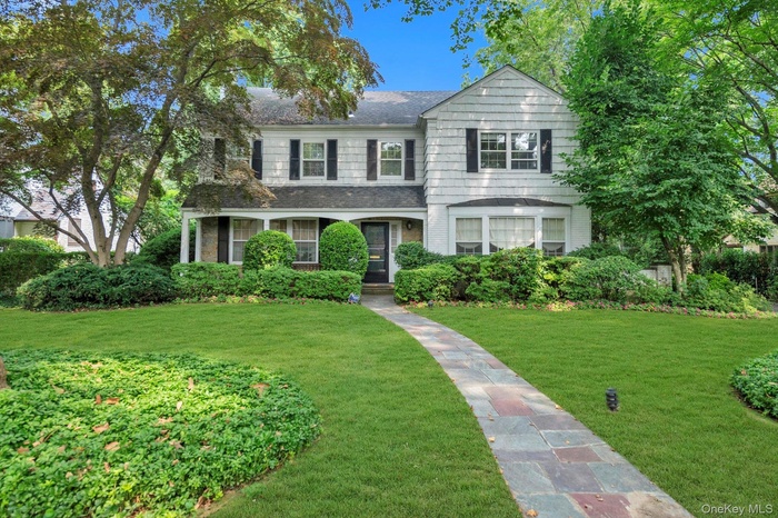 Stunning brick, stone, and cedar shake center hall colonial