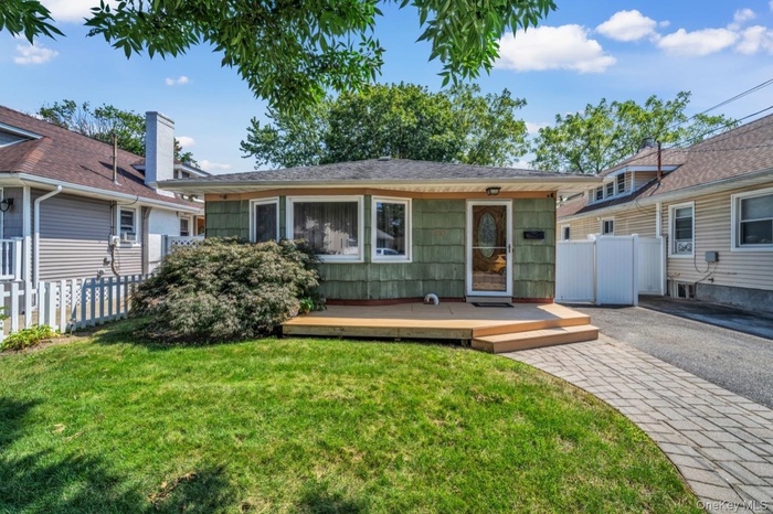 View of front of home featuring a wooden deck