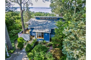 Perched high above the Long Island Sound, this stunning four bedroom, two and a half bath contemporary home offers panoramic water views that will take your breath away.