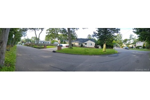Updated expanded Cape cod on corner lot in beautiful Belmont Lake area of West Babylon.